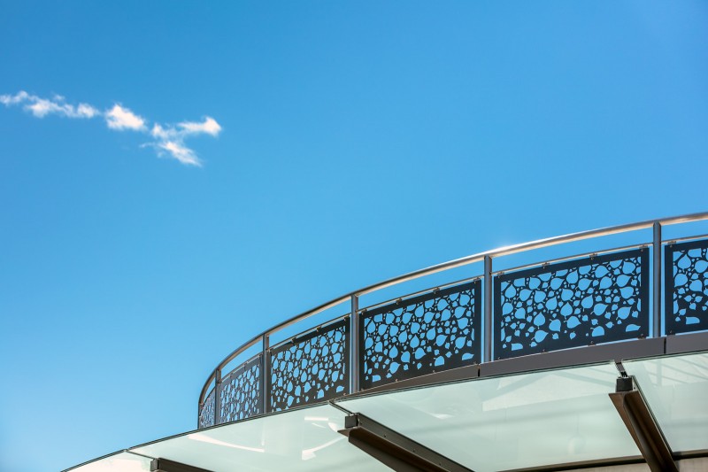 Curved Stainless Steel Laser Cut Railing With Blue Sky Background