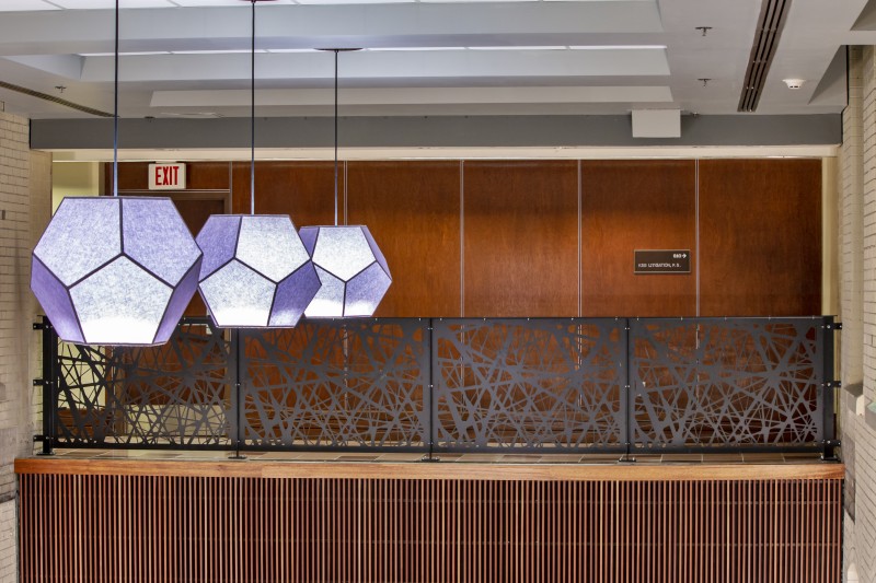 Nest Pattern Mezzanine Railing and Purple Hexagon Lights Above First Floor Lobby