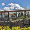 Heavy Duty Cascade Pattern Metal Railing on Rock Wall with Blue Sky Background